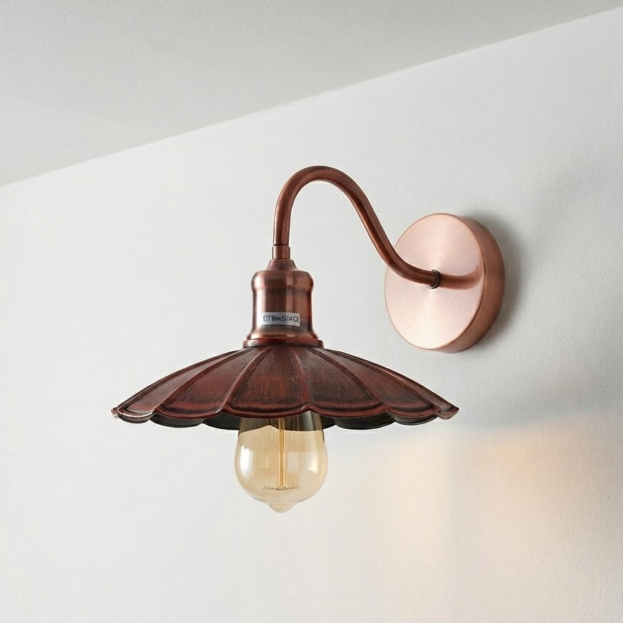 Vintage-style wall light fixture on a white wall