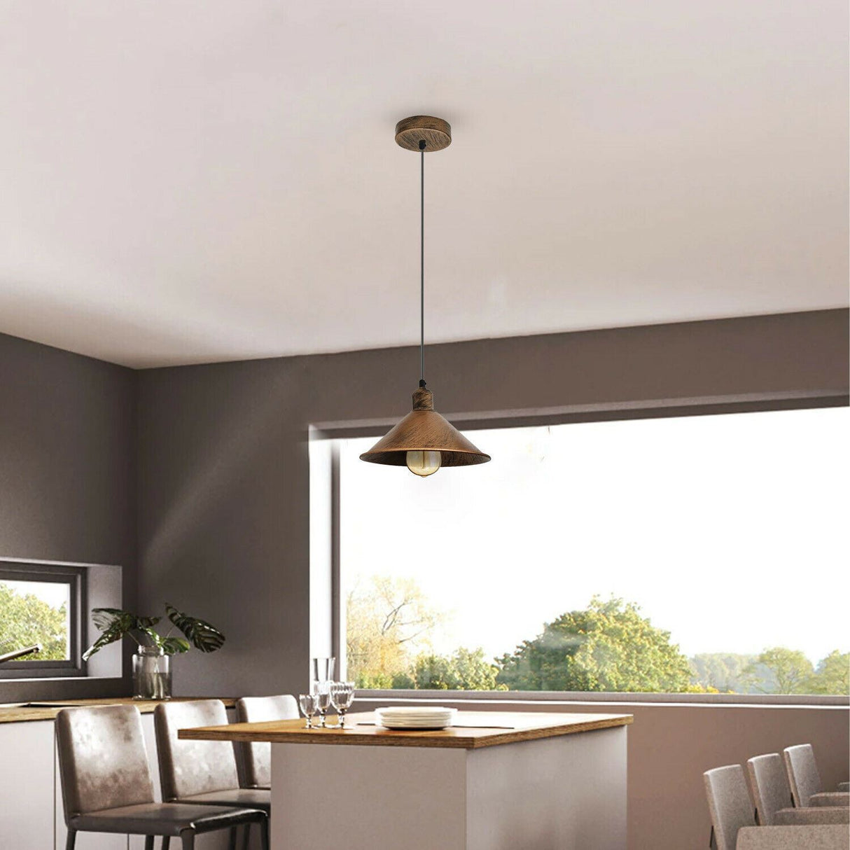 Modern kitchen with pendant light fixture, dining table, and chairs.