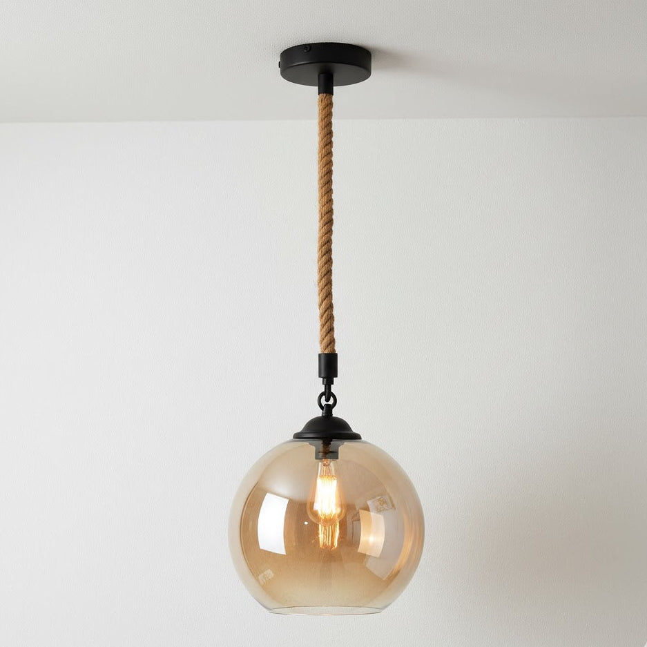 Pendant light with glass shade and rope cord on a white background