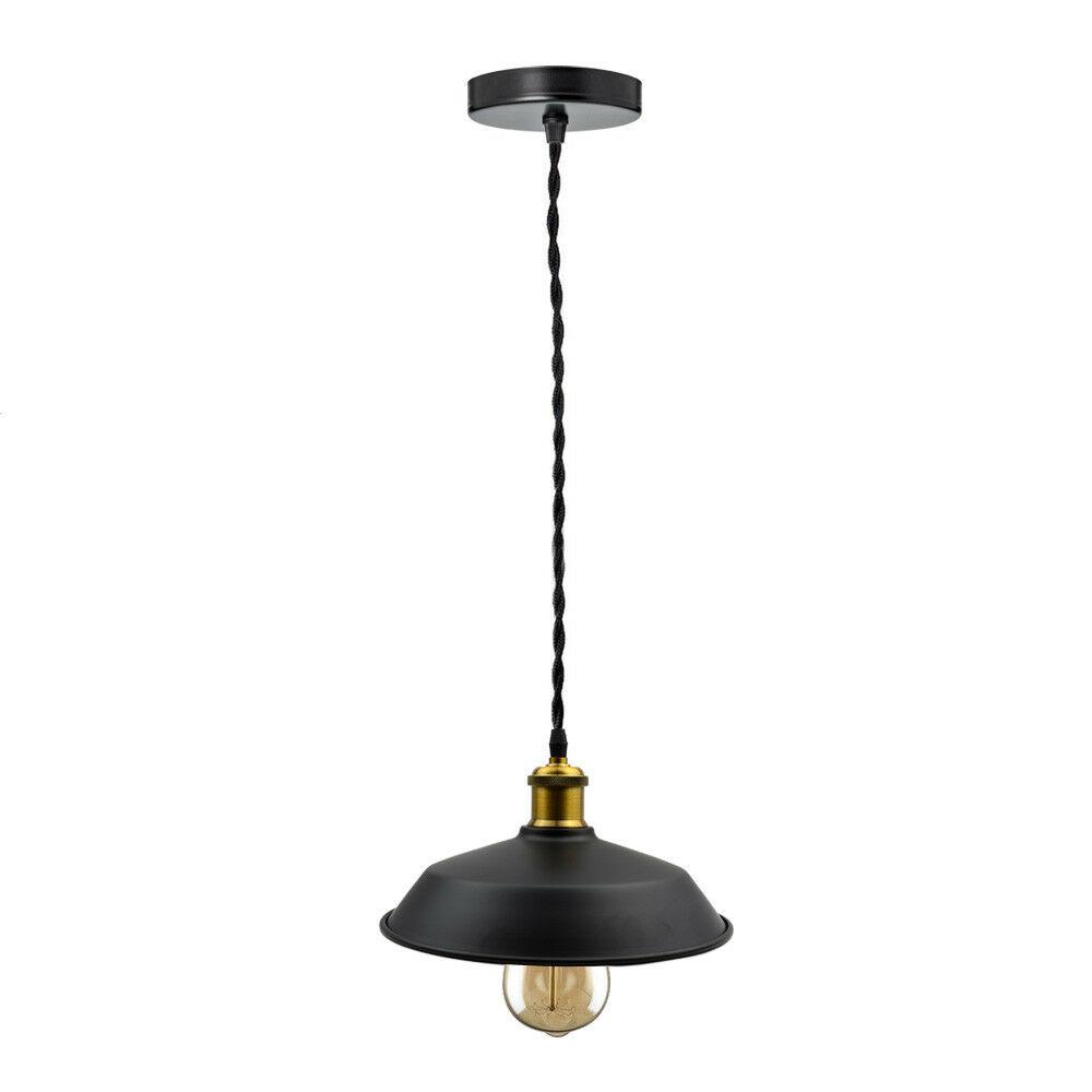 Black pendant light with a gold bulb on a white background