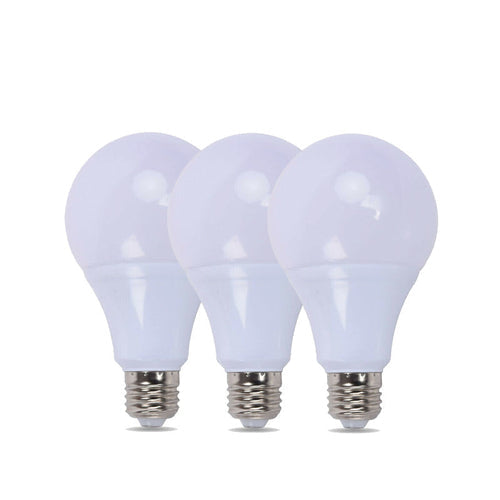Three white light bulbs with silver bases on a white background