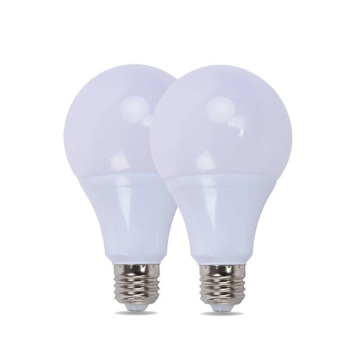 Two white light bulbs on a white background