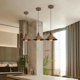 Modern kitchen interior with pendant lights and a window.