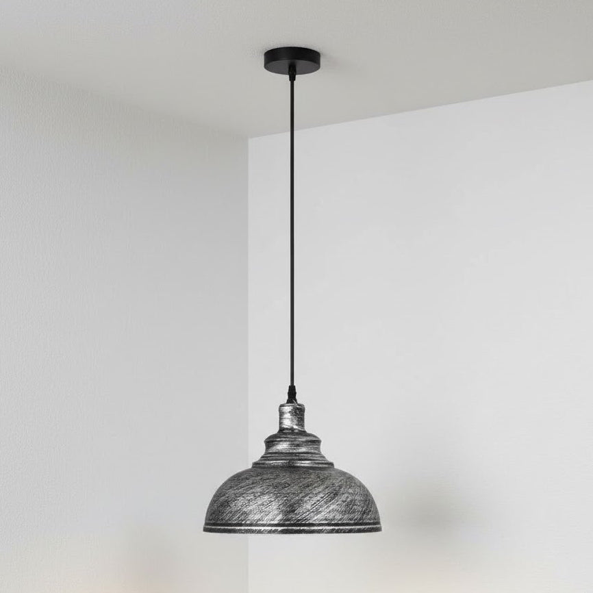 Pendant light with textured metal shade against a plain background