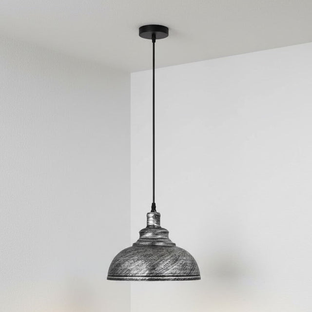 Pendant light with textured metal shade against a plain background