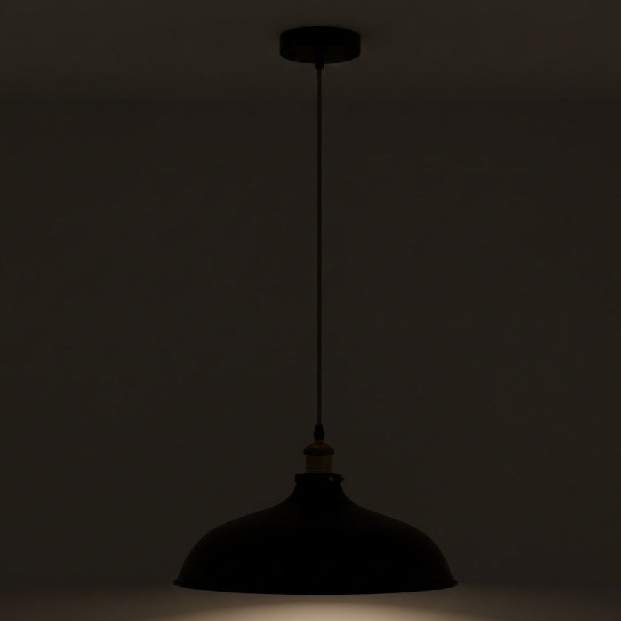 Silhouette of a pendant light against a dark background