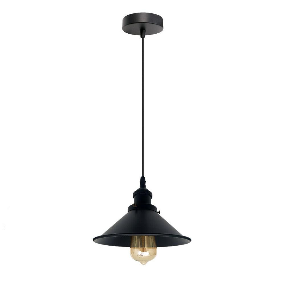 Black pendant light with a lit bulb on a white background