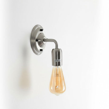 Wall-mounted light fixture with a lit bulb on a white background
