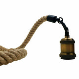 Brass lamp holder with a coiled rope on a white background