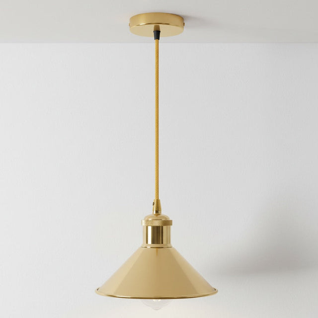 Gold pendant light against a white background