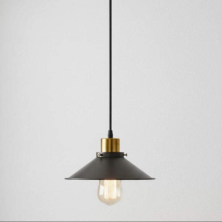 Pendant light with black shade and gold accent on a white background