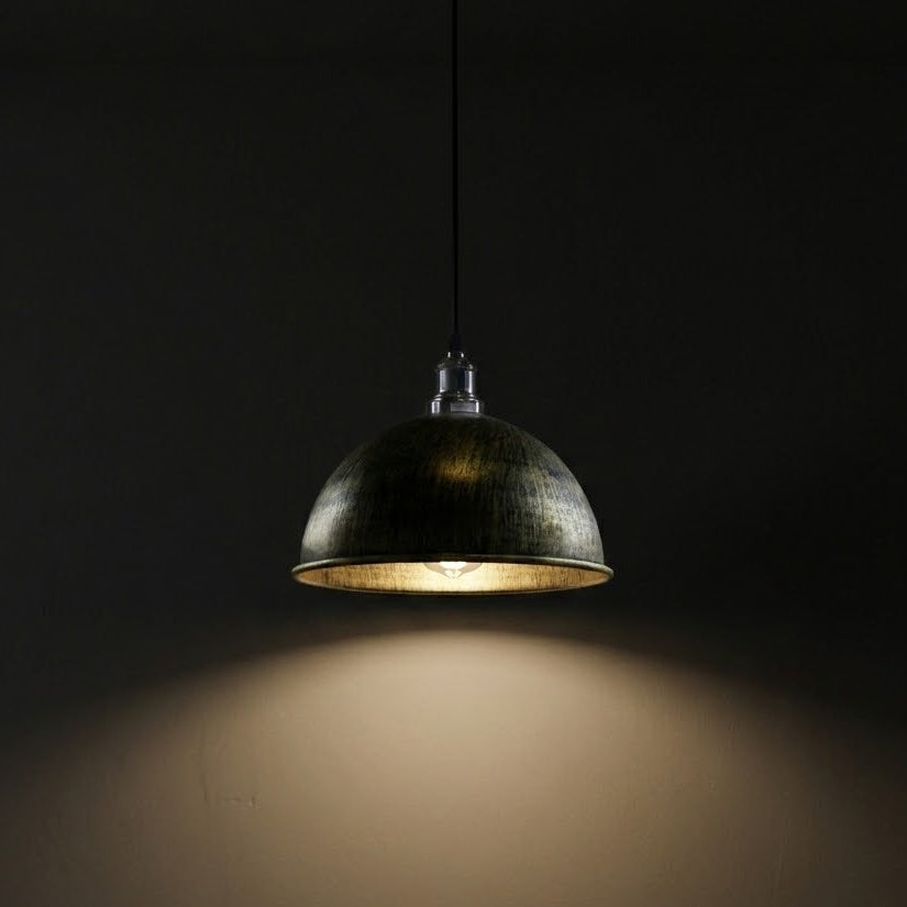 Pendant light fixture casting a warm glow against a dark background