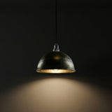 Pendant light fixture casting a warm glow against a dark background