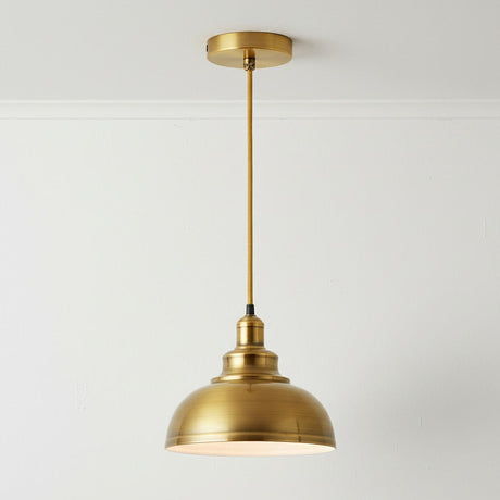 Gold pendant light fixture on a white background