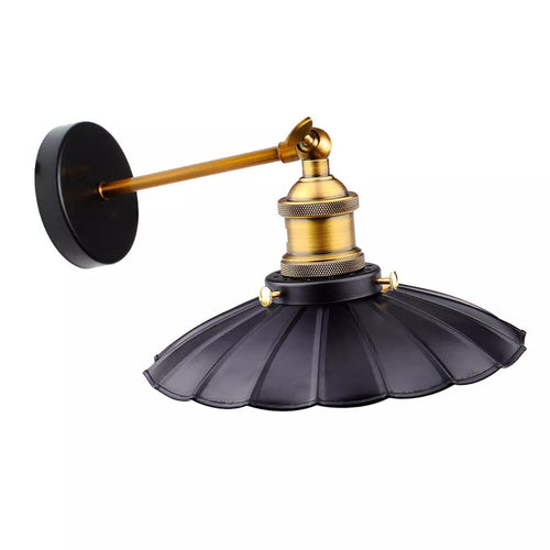 Wall-mounted lamp with black shade and gold fixture on a white background