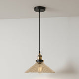 Pendant light with pleated glass shade on a white background