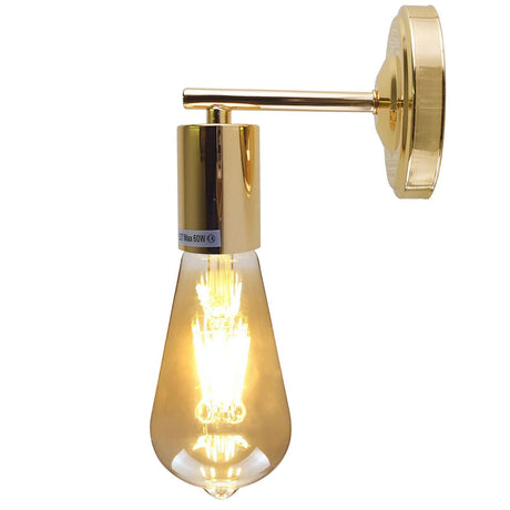 Gold wall-mounted light fixture with a clear glass shade on a white background