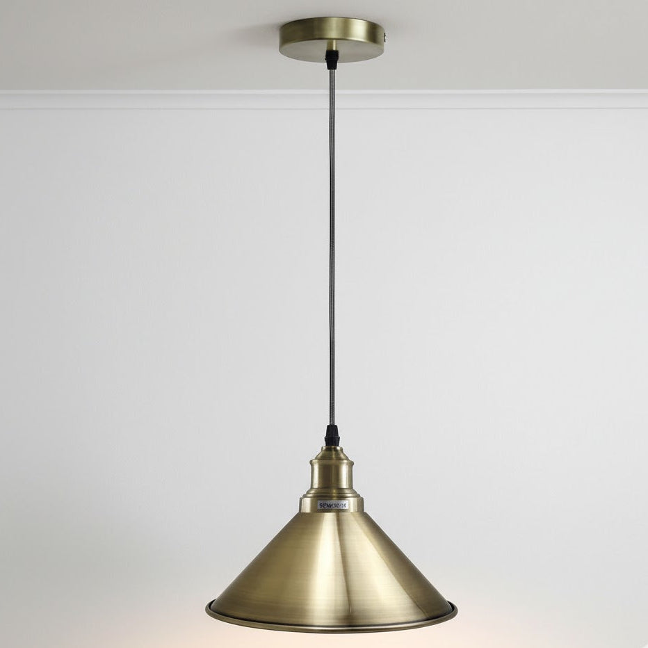 Brass pendant light on a white background