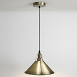 Brass pendant light on a white background