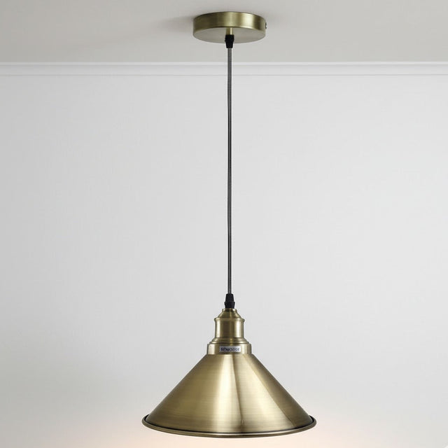 Brass pendant light on a white background