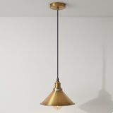 Gold pendant light fixture on a white background