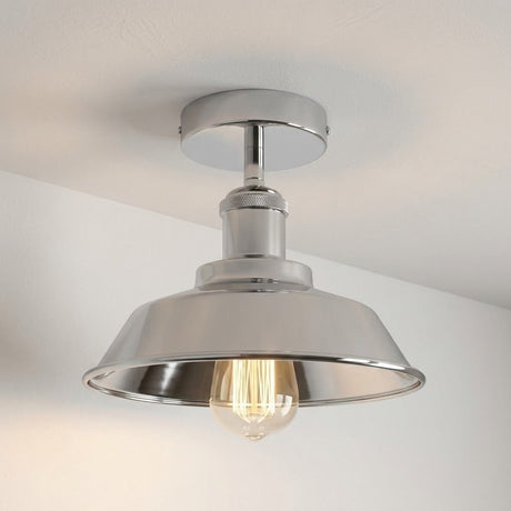 Metallic ceiling light fixture on a neutral background