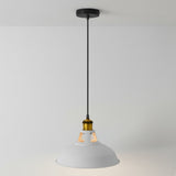 Pendant light with grey shade and gold fitting on a plain background
