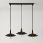 Three black pendant lights with gold accents on a gray background