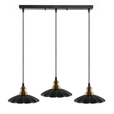 Three pendant lights with black and gold design on a white background