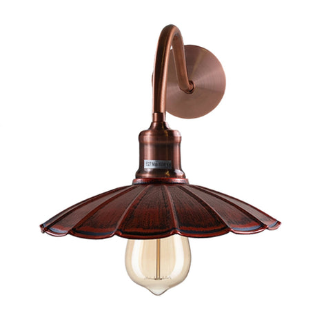 Vintage-style copper wall sconce with a light bulb on a white background
