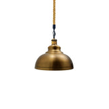 Brass pendant light with a white background