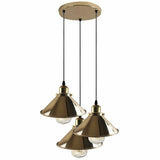 Three gold pendant lights hanging from a ceiling fixture on a white background