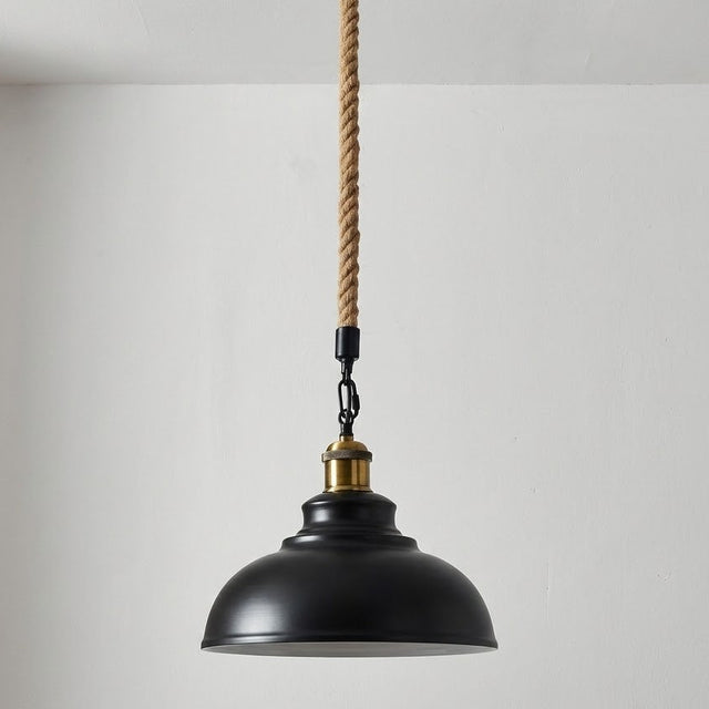 Black pendant light with a rope cord against a plain background