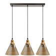Three pendant lights with brown glass shades and gold accents on a white background