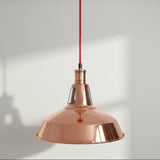 Copper pendant light on a white background