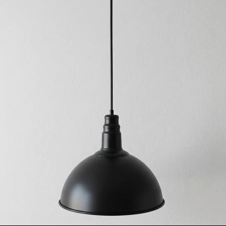 Black pendant light on a gray background