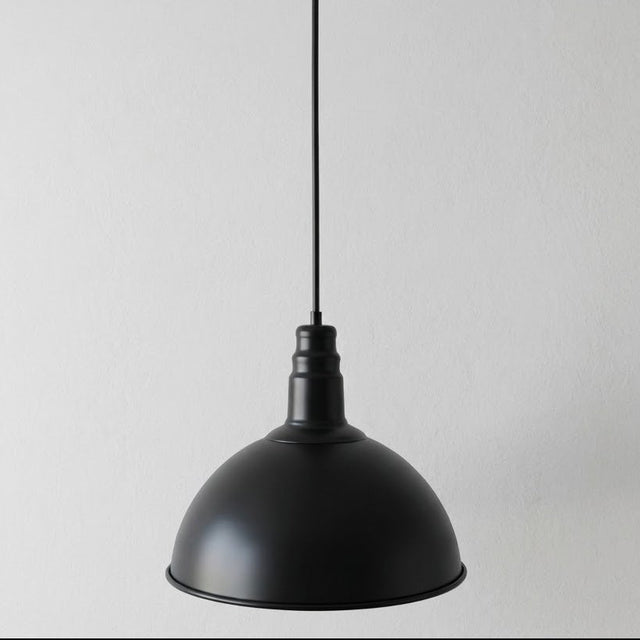 Black pendant light on a gray background