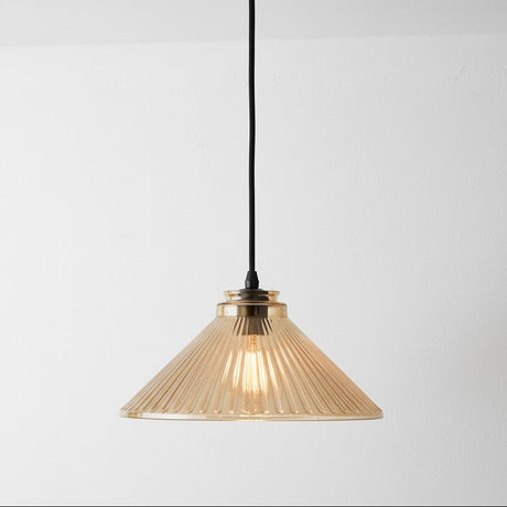 Pendant light with ribbed glass shade on a white background