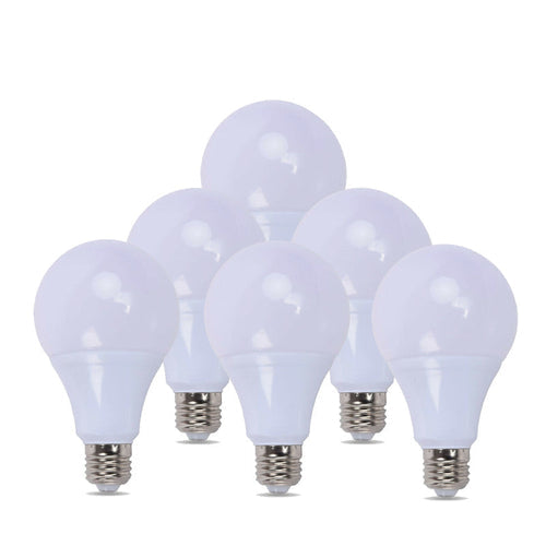 Set of six white lightbulbs on a white background