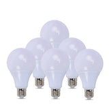Set of six white lightbulbs on a white background
