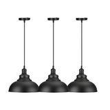 Three black pendant lights on a white background


