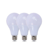 Three white light bulbs with silver bases on a white background


