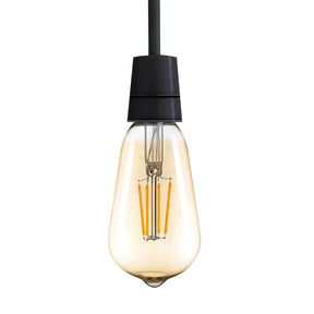 Vintage-style light bulb with a black base on a white background