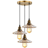 Vintage-style pendant light with three glass shades on a white background