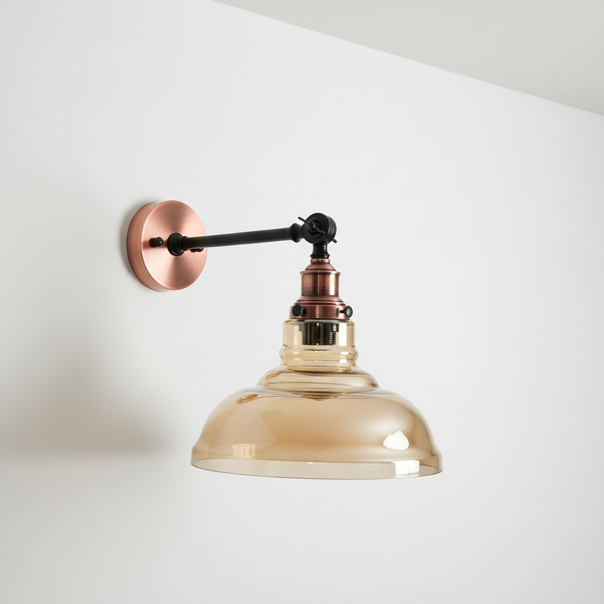 Wall-mounted light fixture with copper and glass design on a white wall