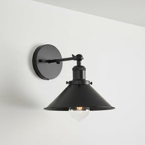 Black wall-mounted lamp with a white background
