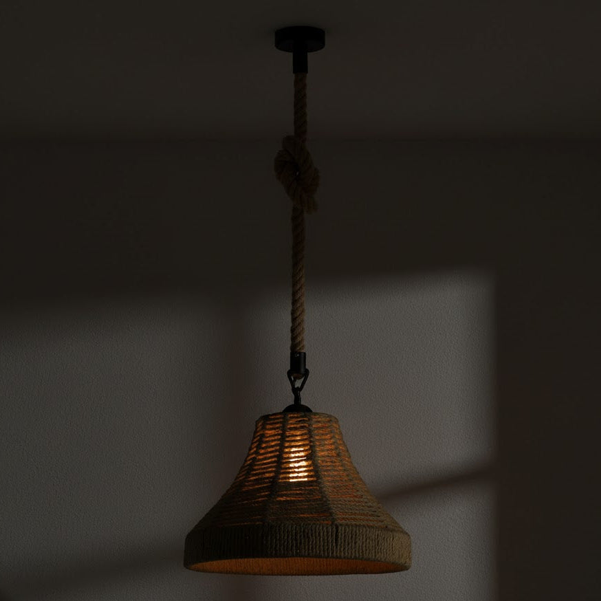Wicker pendant light hanging against a dark background