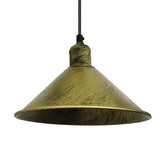 brushed gold pendant light with a white background close up
